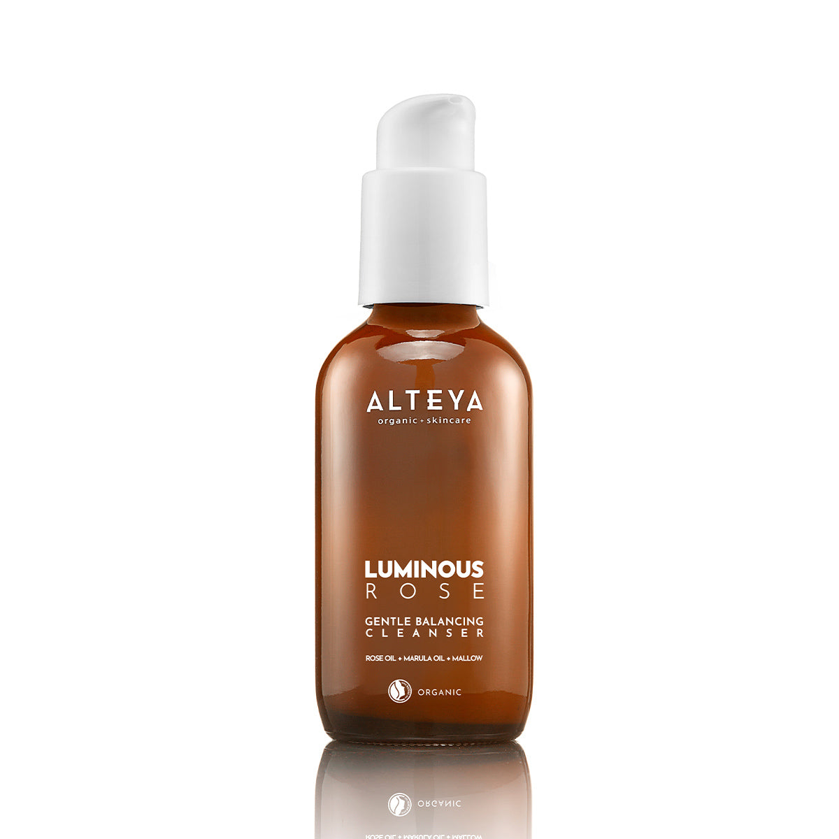 A brown bottle of Gentle Balancing Cleanser Luminous Rose with a white pump on top.