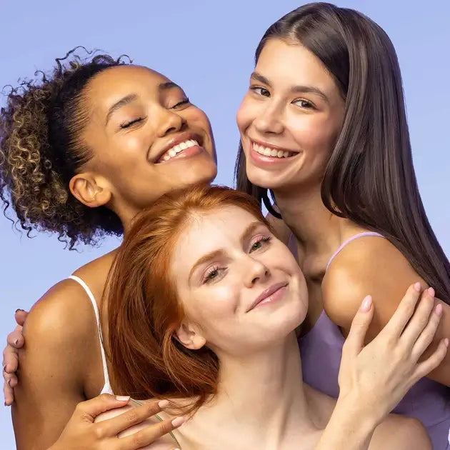 Three young women posing for a photo.