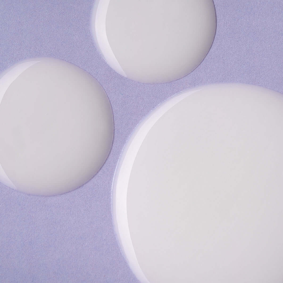 Three Alteya Organics Gentle Balancing Cleanser Luminous Rose on a purple background.