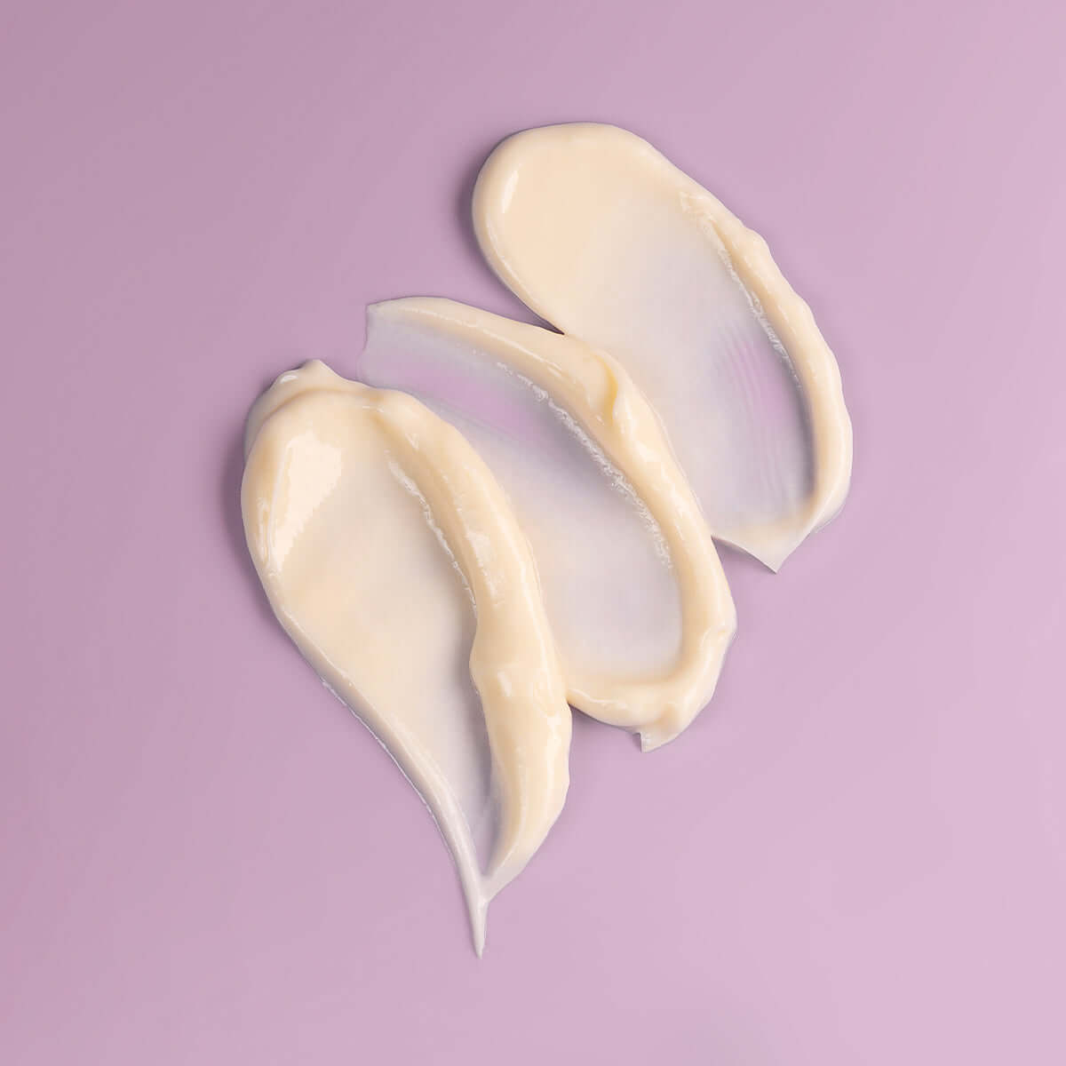 Three pieces of Alteya Organics Bio Damascena Rose Otto Night Moisturizer on a purple background, offering deep hydration.