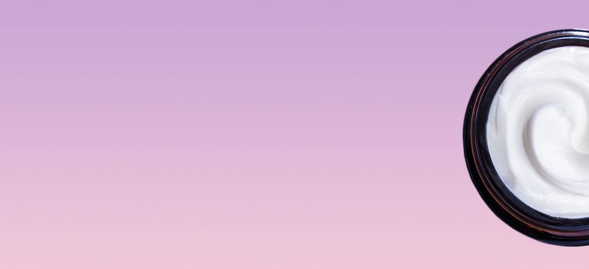 A jar of cream on a pink and purple background.