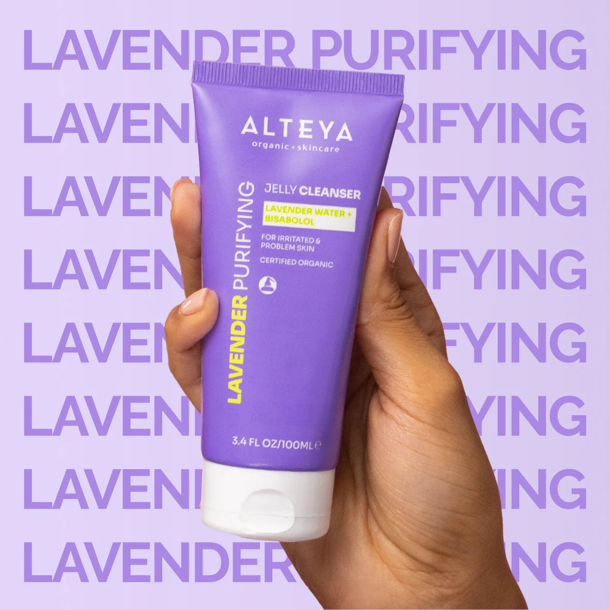 A person displaying Alteya Organics' Lavender Purifying Jelly Cleanser, enriched with organic lavender water and bisabolol.