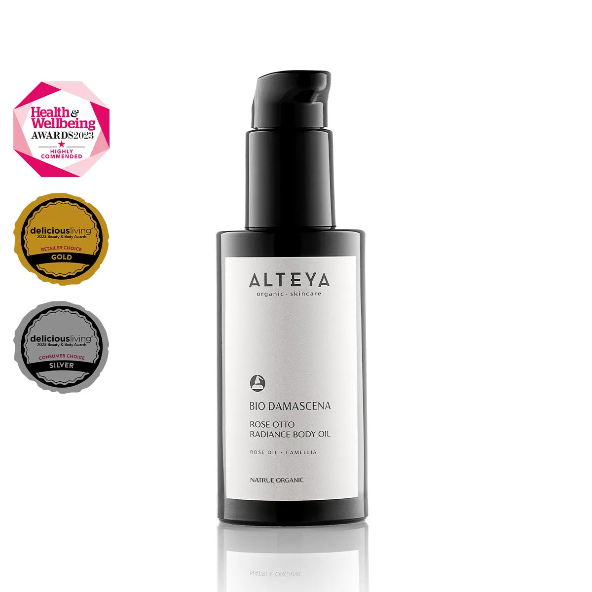 A black pump bottle of Alteya Organic Skincare's Bio Damascena Rose Otto Radiance Body Oil, enriched with a blend of essential oils to enhance skin radiance, is showcased alongside awards from Health & Wellbeing and Delicious Living.