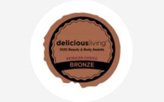 A badge with the word delicious living on it.