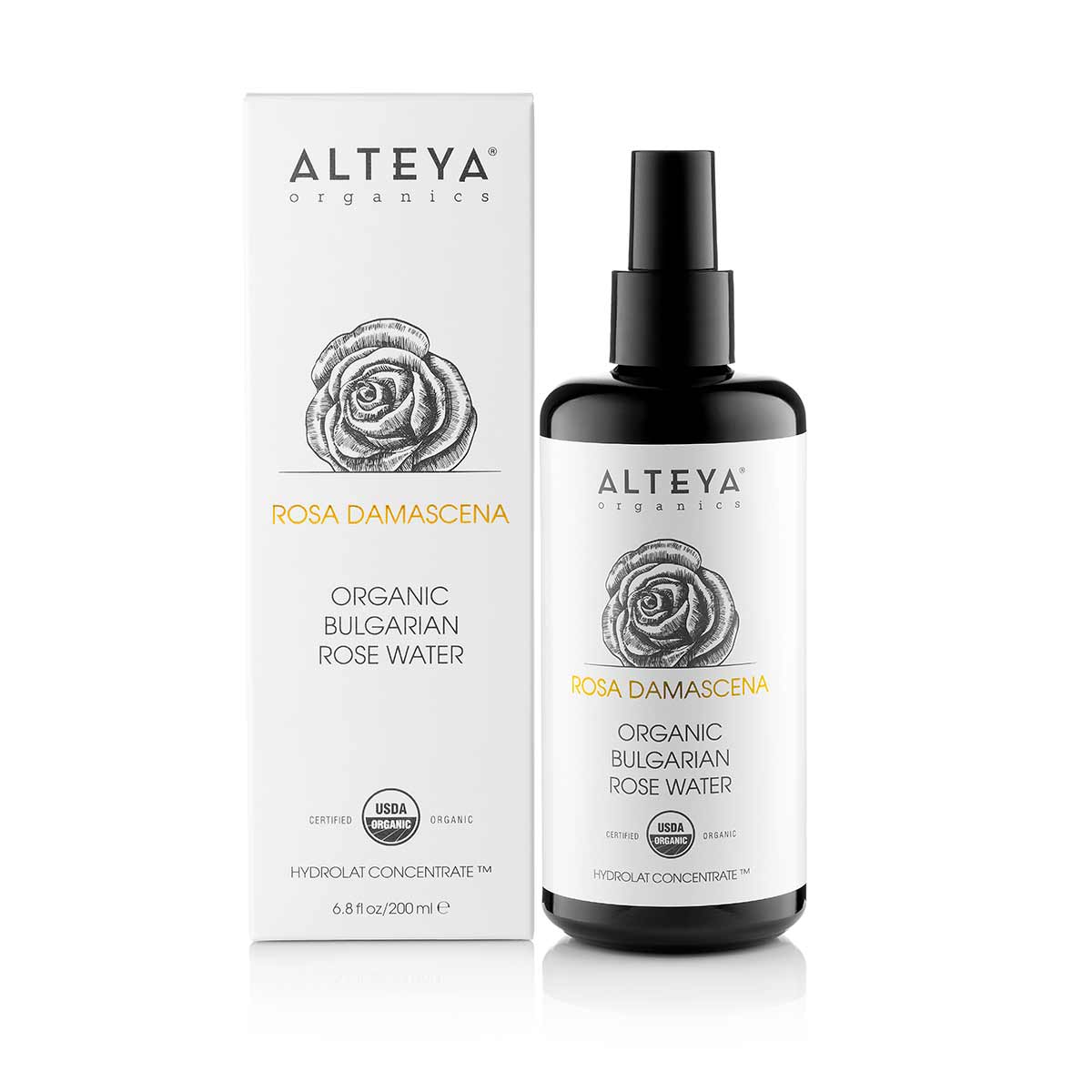 An Alteya Organics Rose Water Toner Mist - 6.8 Fl Oz Violet Glass spray with a box next to it, perfect for enhancing skin.