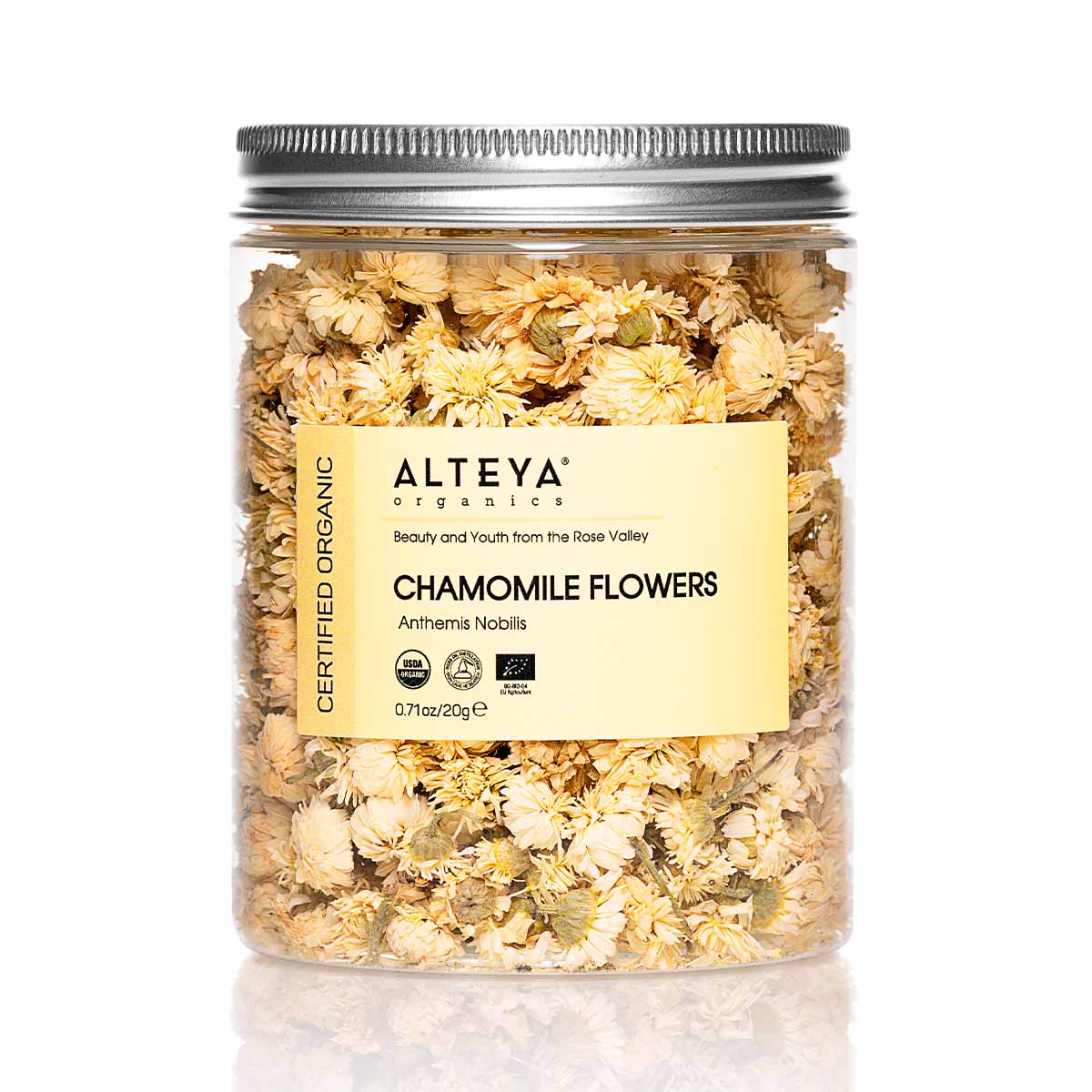 A jar of Alteya Organics Chamomile Flowers, known for its healing properties and commonly used in tea, on a white background.